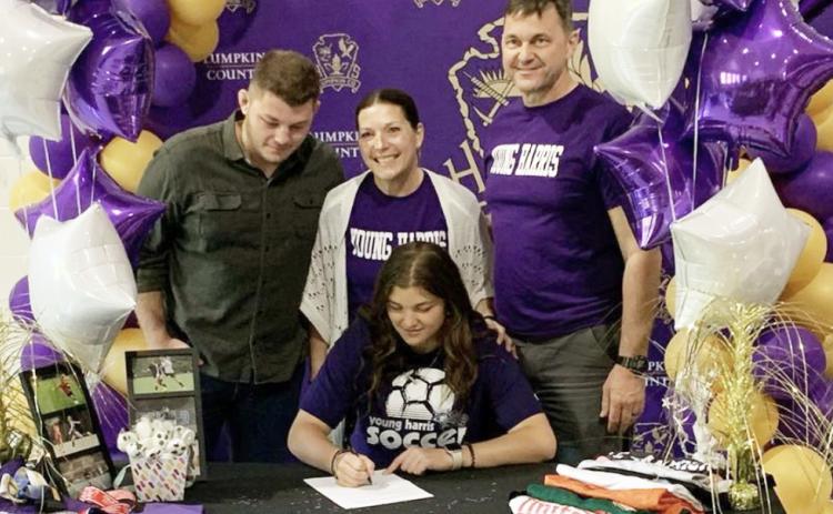 Lumpkin soccer star Reagan Spivey signs with Young Harris College to play soccer in a signing ceremony with her family.