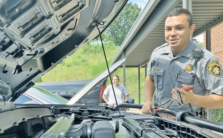Officer Ceszar Ramos was ready with the jumper cables on Monday morning when Madison Pruitt's car unexpectedly died out in the Lumpkin County Sheriff's Office parking lot. That's all part of the job for LCSO deputies.