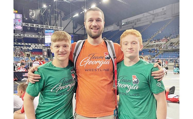 Lumpkin wrestling’s Team Georgia representatives at Nationals, from left, Nathan Nielsen, coach Will Johnson and Austin Marshall, competed in Fargo at what is known as the largest wrestling tournament in the world last month.