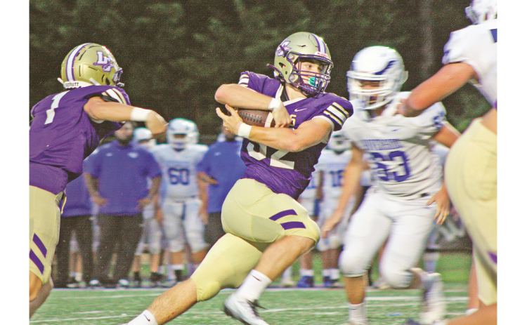 Junior fullback Mason Sullens (32) rushed for 121 yards on 13 carries and scored four touchdowns as Lumpkin won its season opener.