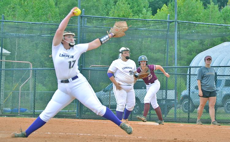 Lumpkin’s Natalie Shubert tosses a pitch with a Dawson runner on first base last week. The Tigers narrowly defeated the Lady Indians 2-0.