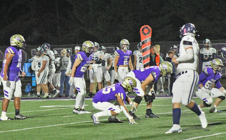 The Lumpkin County defense lines up against West Hall. The Indians earned a 48-7 victory at home in the regular season finale.