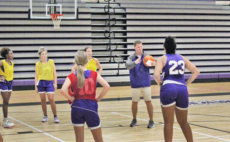 LCHS girls basketball Head Coach David Dowse speaks to his team during a pre-season practice last week.