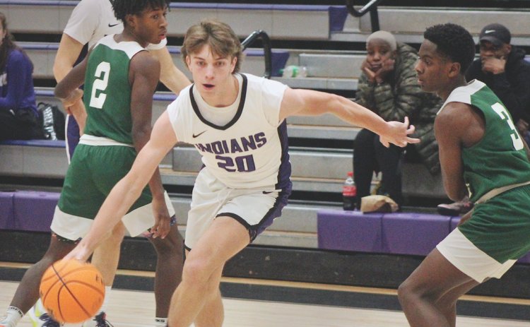 Lumpkin sophomore TJ Gaddis advances the ball toward the basket in the Indians’ victory over Cross Keys.