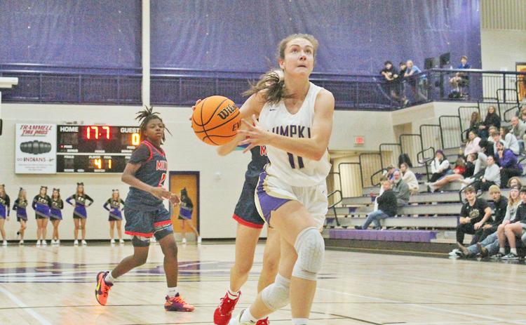 Lumpkin County’s Mary Mullinax looks for an opening to the basket against the Milton defense. Mullinax and teammate Averie Jones were voted MVPs of last week’s tournament.