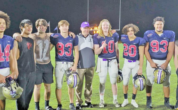 Players representing Lumpkin County in the FCA East vs. West All-Star Classic were (from left) Cam Stringer, Mason Sullens, Caleb Norrell, head coach Heath Webb, Cooper Scott, Tavion Lawrence and Jay Grizzle alongside members of the LCHS Crunk Crew.