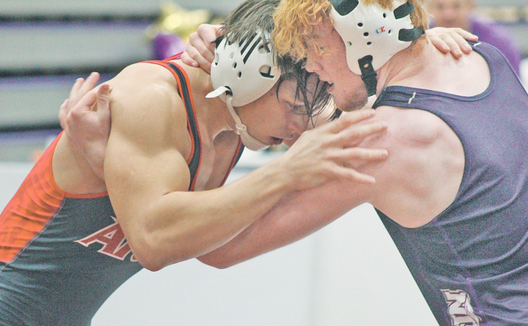Lumpkin wrestler Jacob Pricer ties up an opponent in the Holiday Nutcracker Tournament last week.