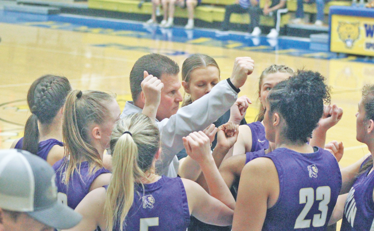 Girls basketball Head Coach David Dowse rallies the Lumpkin team during a timeout in the Lady Indians Final Four victory. The team will play in the finals this Friday.