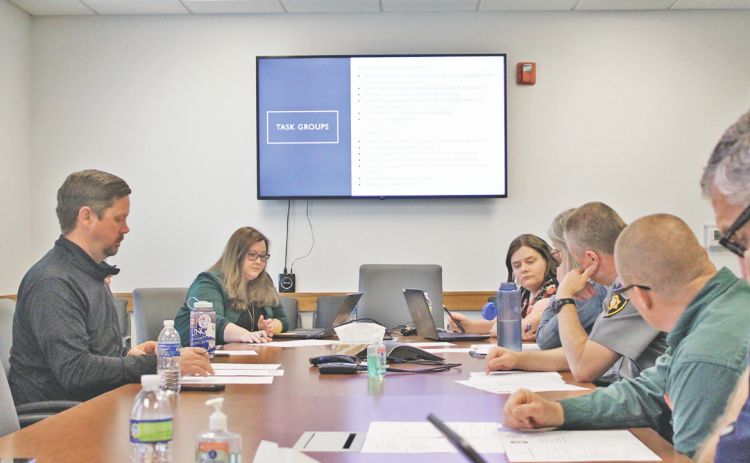Members and staff of the Lumpkin County Recycling and Litter Committee debate assignments and procedures at their introductory meeting on March 16.