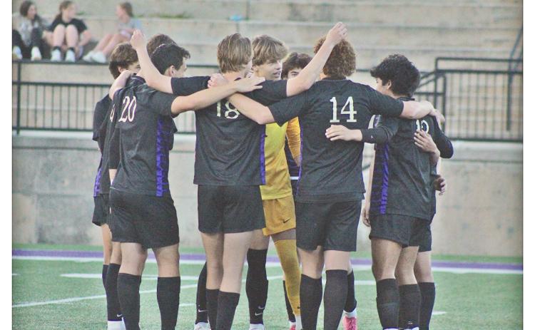 The Lumpkin County boys soccer team huddles up before their game against Wesleyan.