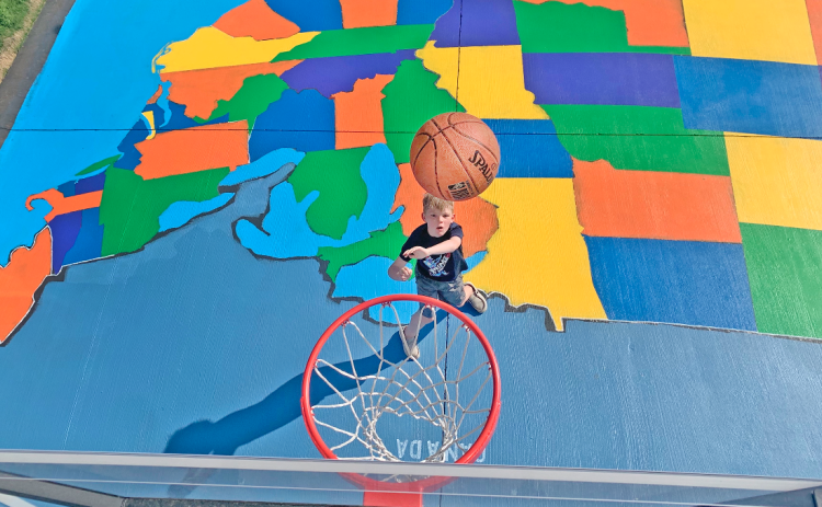Third grader Beau Guy has managed to memorize all the state capitals, while working on his jump shot at the same time, thanks to a super-sized map of the U.S.A. in his driveway.
