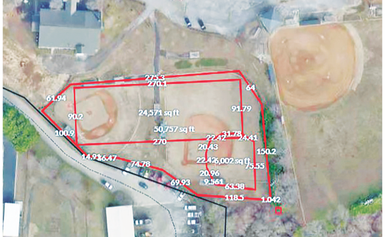 In this aerial photo Yahoola Creek Park baseball fields four and six are visible, with red lines indicating the possible locations of a future artificial turf multipurpose field and baseball diamond.