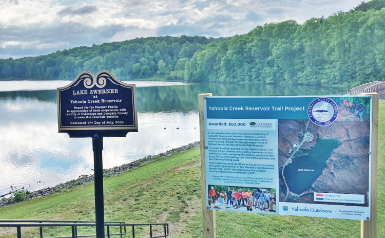 A display near the beginning of the Yahoola Creek Reservoir trail shares a planned expansion and other improvements that are set to be made to the area.