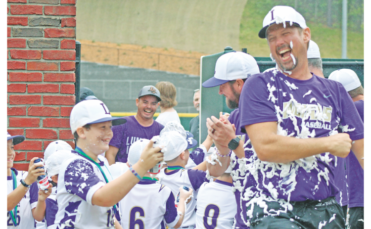 Coach Tucker Greene, Carson Rogers and the 8U baseball All-Stars celebrate their State Championship with a joyful shaving cream shower after securing the title with a win over Dodge County.