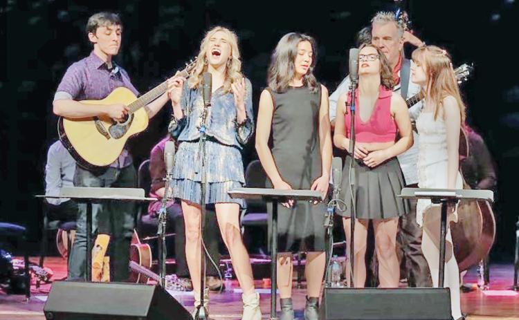 Local artist Mia Dierkes, second from left, takes to the stage in Memphis, Tennessee to close out the Acoustic Music Project.