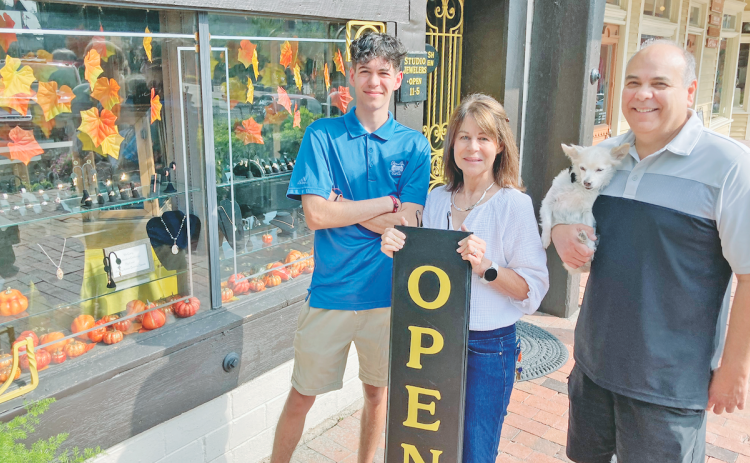 Once again, the Studio Jewelers shop on the Public Square is open for business as new owners Bill and Carol Lucker, along with their son Harrison and dog Gia, are settling into their new hometown. (Photo by John Bynum)