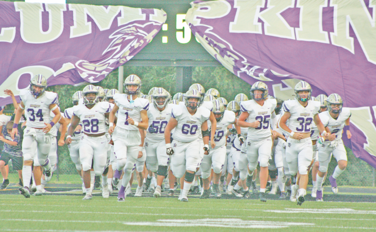 Lumpkin County storms the field to take on the Temple Tigers.