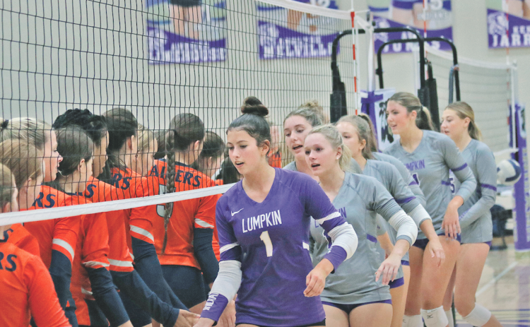 The Lumpkin County High School volleyball team shakes hands with Habersham after their victory.