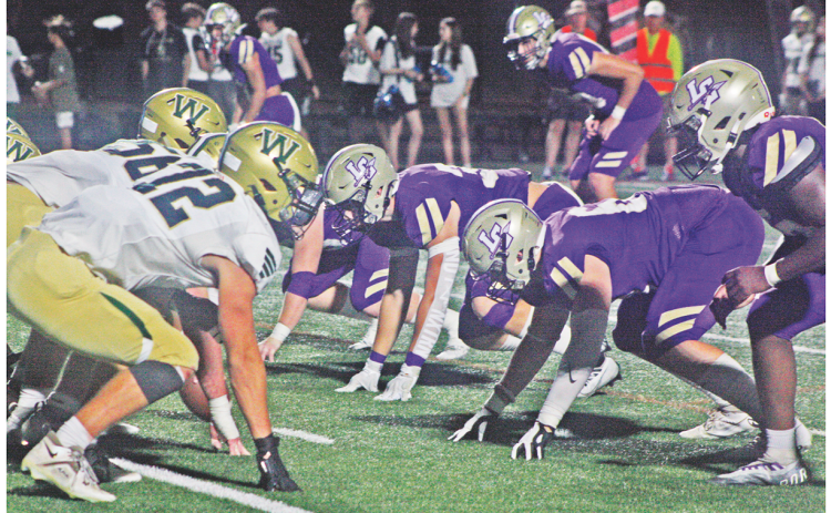 The Lumpkin defensive line squares off with the Wesleyan Wolves in last week’s game as the Indians came away with a 30-21 victory.
