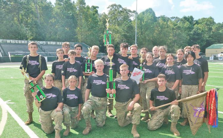 The Lumpkin Raider squad with their newly earned trophy after a hard-fought competition at Grayson High School.