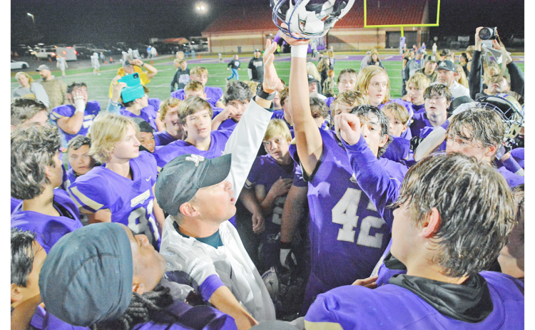 Head coach Heath Webb celebrates with the team after Lumpkin’s round two playoff victory over Oconee. (Photo by John Bynum)