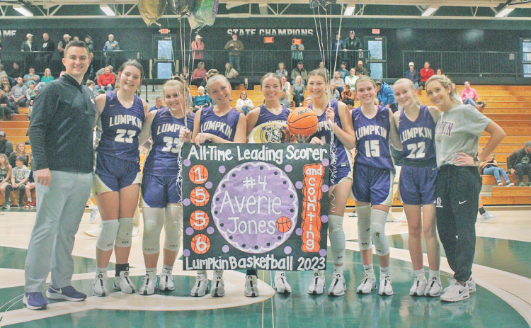 The Lady Indians Basketball team celebrates Averie Jones’ huge accomplishment of breaking the all-time scoring record. (Photo by Eligha Roper))