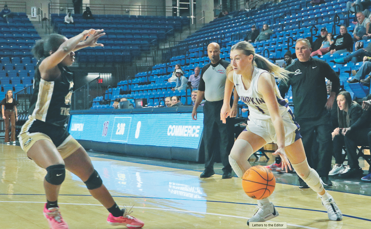 Maddie Lee drives to the hoop in Lumpkin’s game against Commerce at UNG last week.