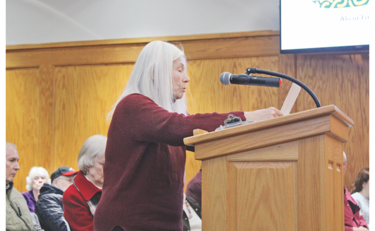 Margo Booth, whose home backs up to the Squaretail property, explains her objections to the proposed development.