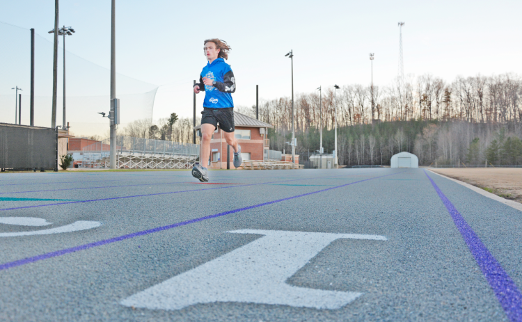 LCHS junior Wyatt Windham practices on the newly-surfaced high school track.  The standout athlete said the new surface should help prevent injuries and allow runners to wear the proper track cleats for racing.