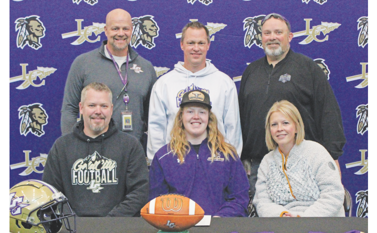 Pictured (front row, from left) are Adam Scott, Cooper Scott and Megan Scott. Back row are Principal Billy Kirk, Head Coach Heath Webb and Athletics Director Steve Horton.