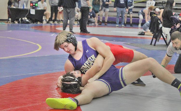 Eighth ranked Will Soles pins one of his opponents at the Gold City Holiday Nutcracker tournament.