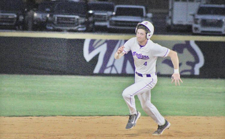 Lumpkin County’s Mason Hester rounds second after a huge hit that he stretched for a triple.