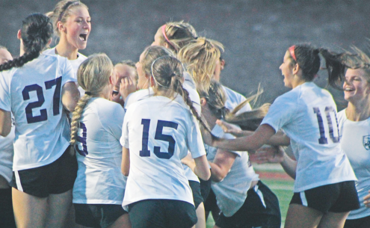 The Lumpkin County High School Indians celebrate their big win after a penalty kick showdown with the Dawson County High School Tigers.