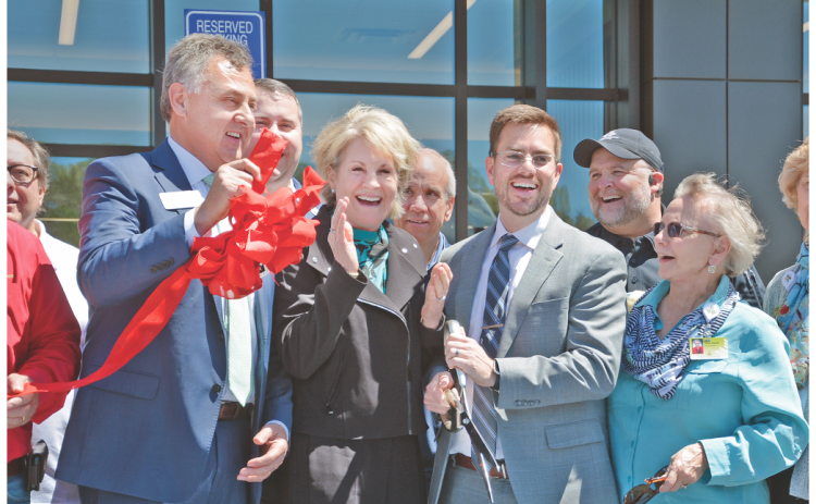 A jubilant crowd celebrated the opening of the new Northeast Georgia Medical Center Lumpkin location on Saturday. Pictured (from left) State Senator Steve Gooch, President & CEO of Northeast Georgia Health System Carol Burrell, NGHS Vice President of Regional Hospitals Kevin Matson, and Northeast Georgia Physicians Group board member Jane Taylor were among the many representatives who gathered to mark the beginning of the new era in local healthcare. (Photo by John Bynum / The Nugget)