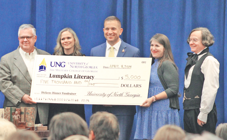 Pictured, from left, Lumpkin Literacy Chair Emeritus Geoffrey Kridel, UNG First Lady Jessica Shannon, UNG President Michael Shannon, Lumpkin Literacy Chair Caroline Smith, and Dr. Brian Corrigan were all smiles as UNG presented a check for $5,000 to Lumpkin Literacy. (Photo by Keith Murden / The Nugget)