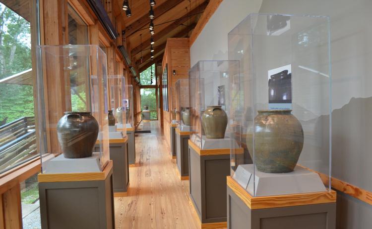 Stephanie Hill/ The Folk Pottery Museum also houses a featured exhibit that changes twice a year. Shown is an exhibit from Dave Drake, an enslaved African-American master potter and poet from the 1800s.