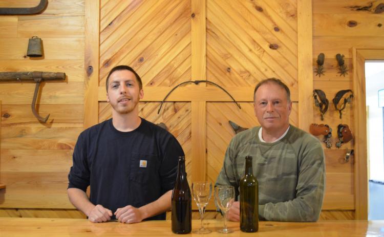 Lane Williams and Lloyd Allison stand behind the bar in the tasting room for Tesnatee River Winery and Meadery. (Photo/Stephanie Hill)